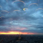 Among the clouds in the sky over the Russian River, a group of disc-shaped UFOs conceals itself