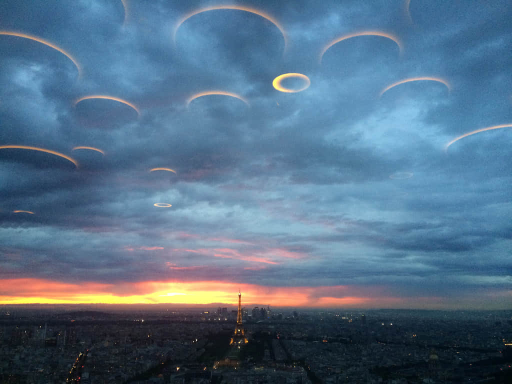 Among the clouds in the sky over the Russian River, a group of disc-shaped UFOs conceals itself